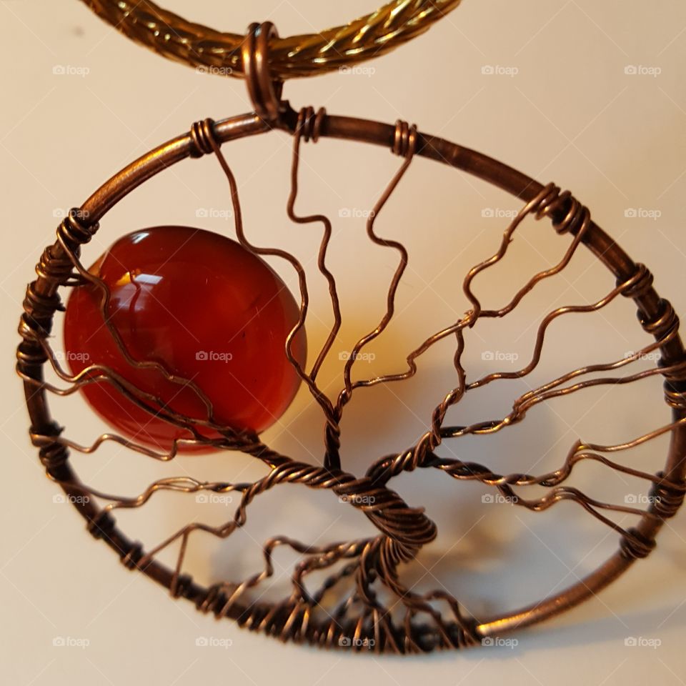 Autumn pendant, hand wired with a carnelian gemstone "moon."