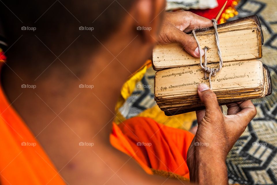 Monk reading prayers