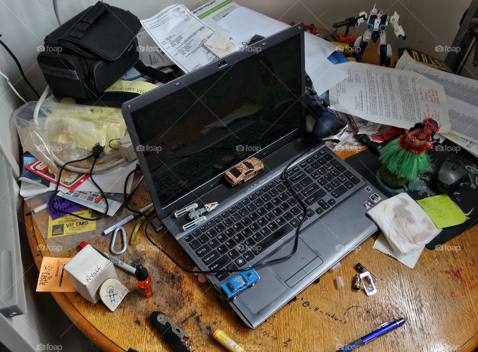 Cluttered Desk. Home Office Desk Filled With Clutter
