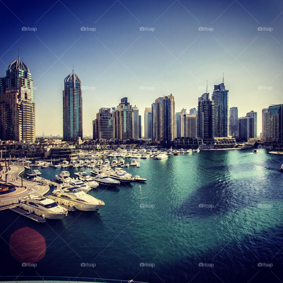 Dubai marina. Dubai marina with boat and skyscraper 
