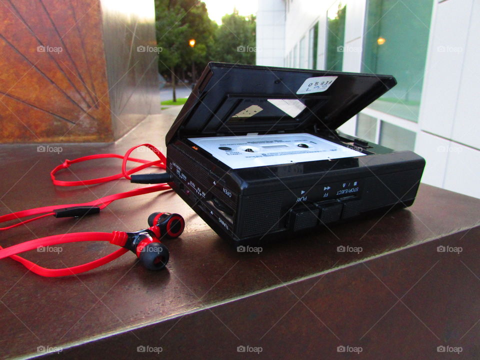 cazzette, cassette player with with red and black earphones