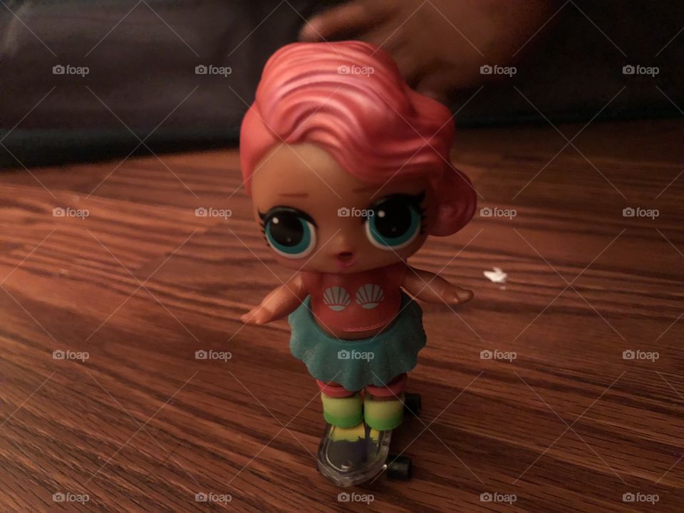 LOL doll Treasure is skateboarding