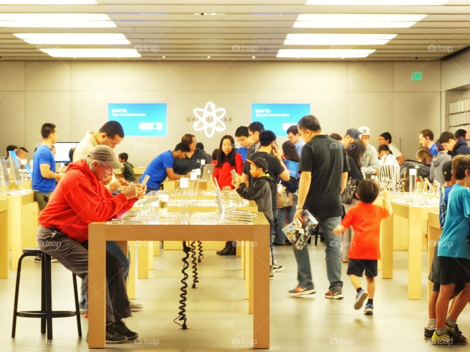 Customers In An Apple Computers Retail Store
