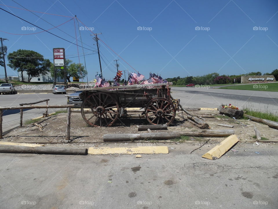 old covered wagon. This is a picture of a covered wagon on display at a store in Jacksboro Texas