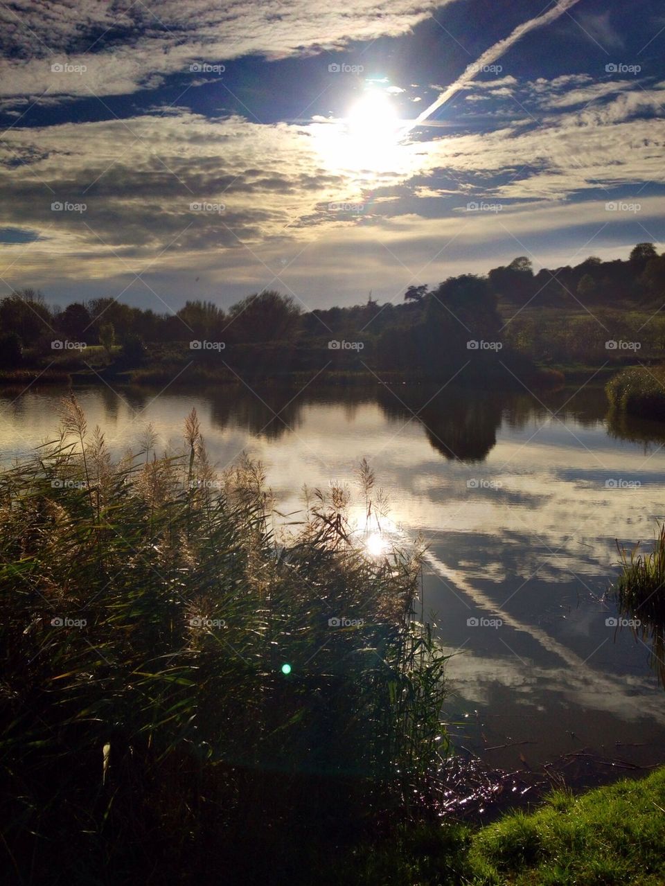 Clouds reflected in a pond in Purdown, Bristol UK
