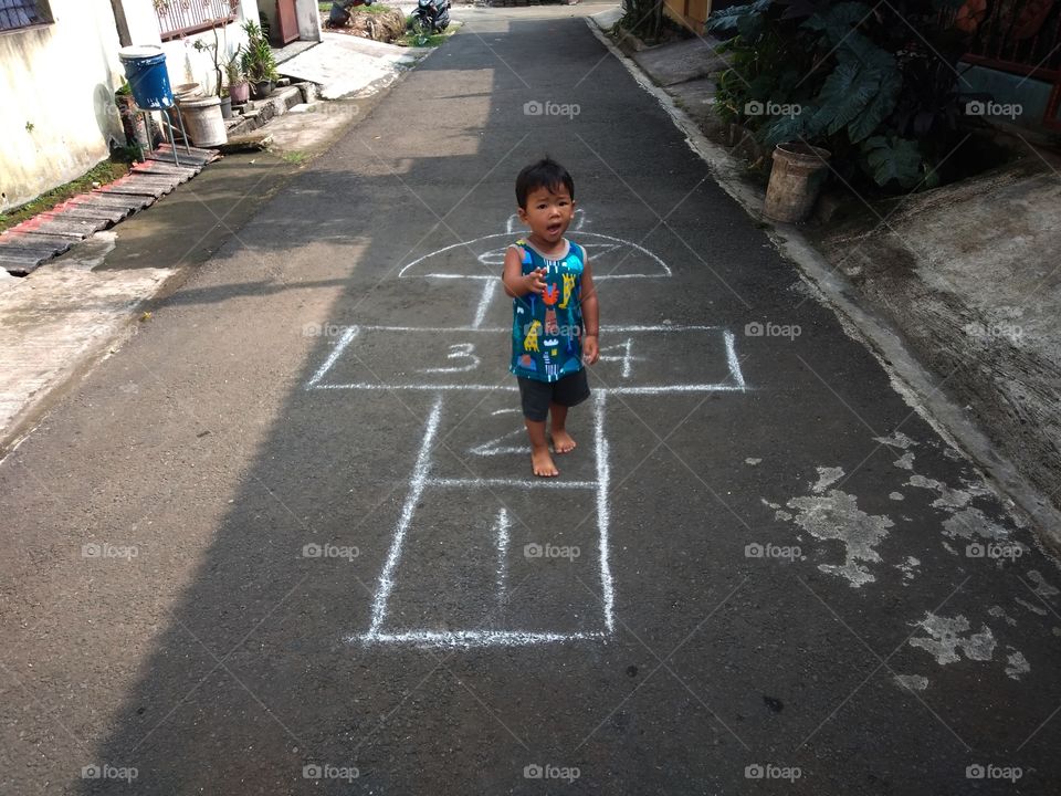 boy walking barefoot in the morning