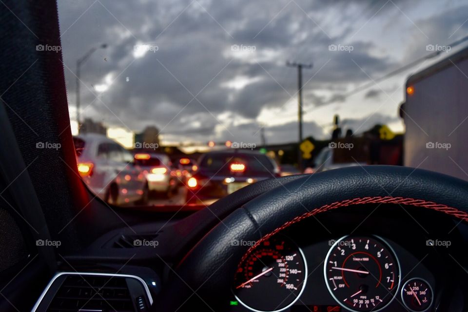 A vibey picture from a bmw 328i in the middle of traffic