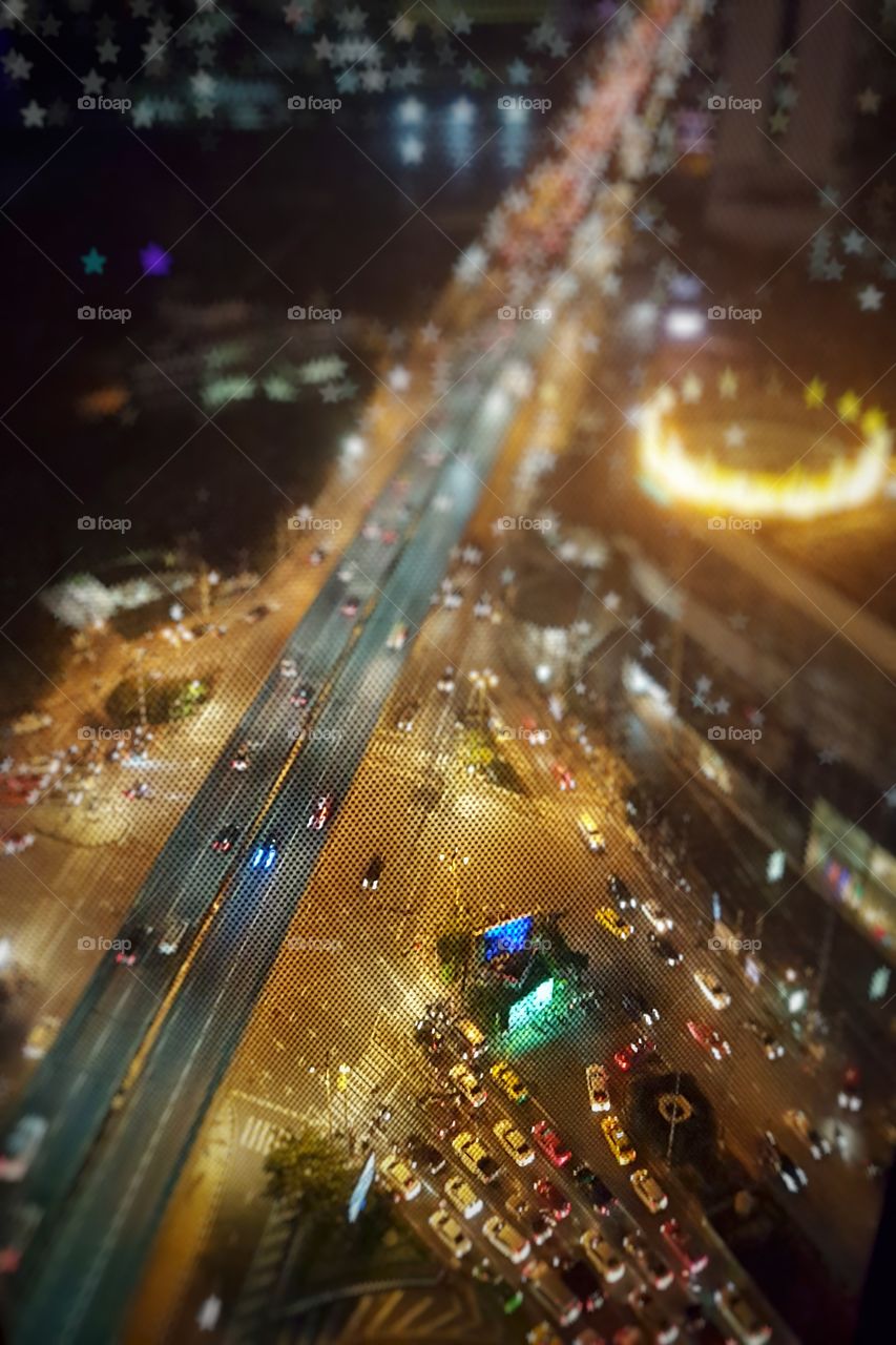 view from above of traffic in the city at night