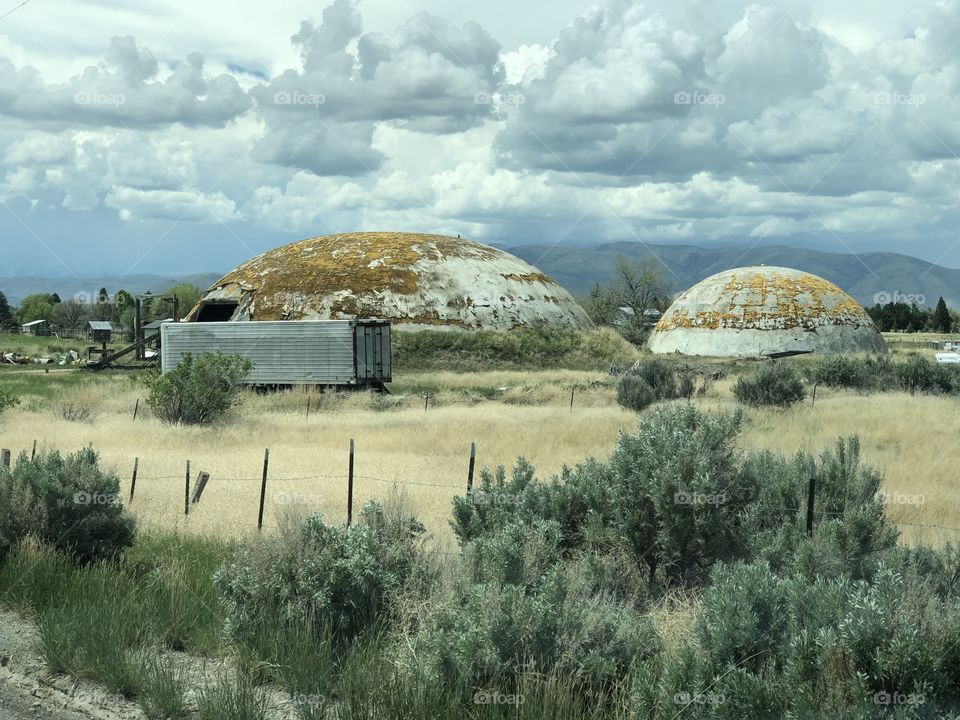 Giant helmets!! This are actually abandoned warehouses in farms in Black Foot Idaho. 