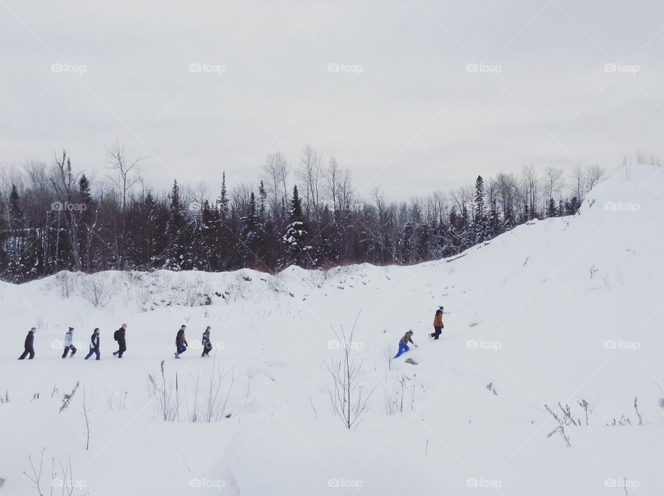 A group of friends walking winter hiking trails