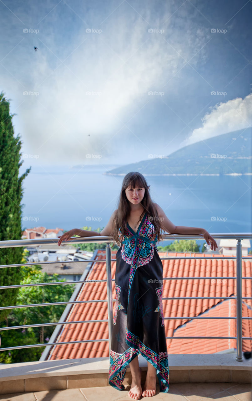 Young woman on a balcony 