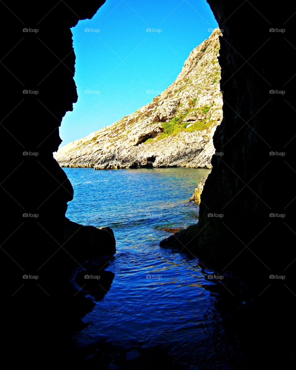 Beautiful cave in xlendi bay, gozo Malta