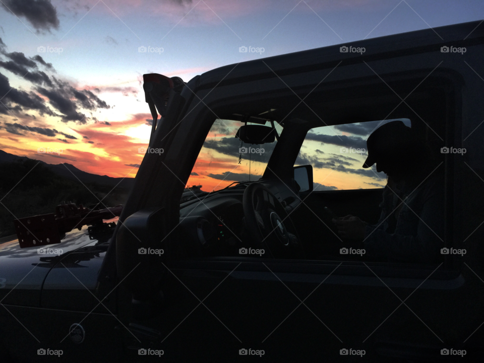 Jeep Sunset. Passenger in Jeep 