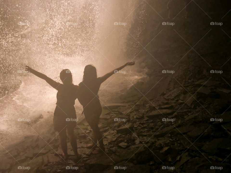 Under the waterfall