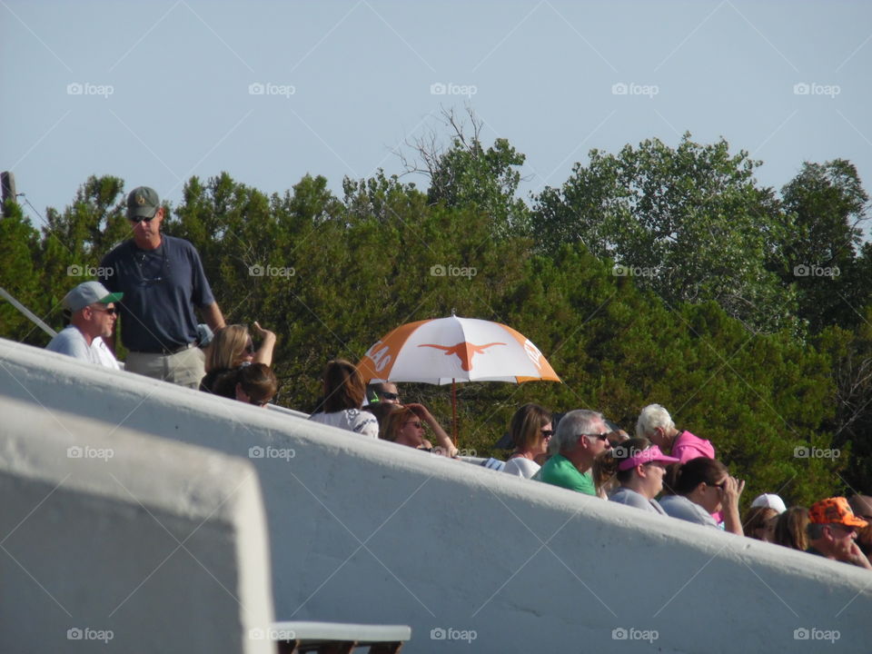 hook em horns. This is a picture I took while attending the local football game. 👣 🚶 🏃 🔥 💨