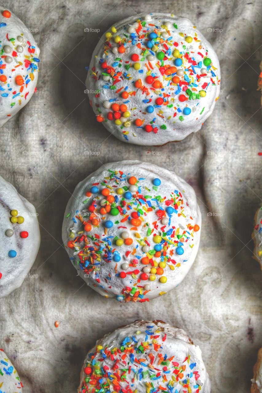 several muffins with a colored confectionery package. view from above.