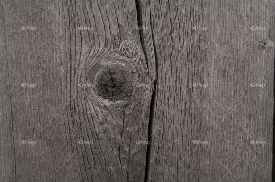 Wood knot on a wall of an old house in Røros, Norway