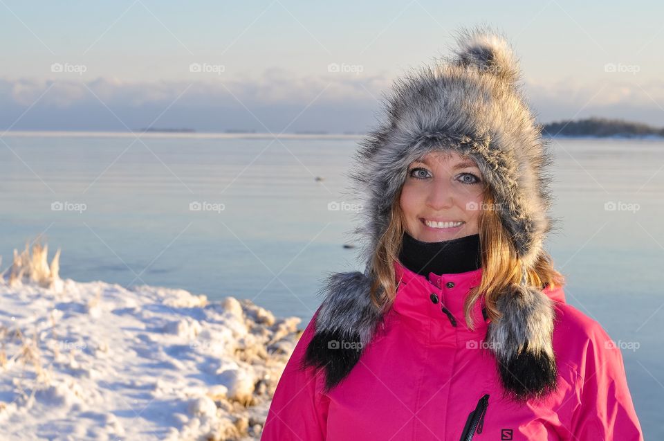 Young woman standing on snowy landscape