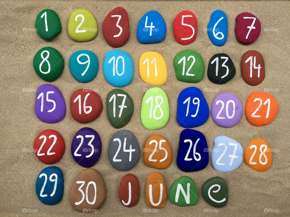 June calendar on colored stones 