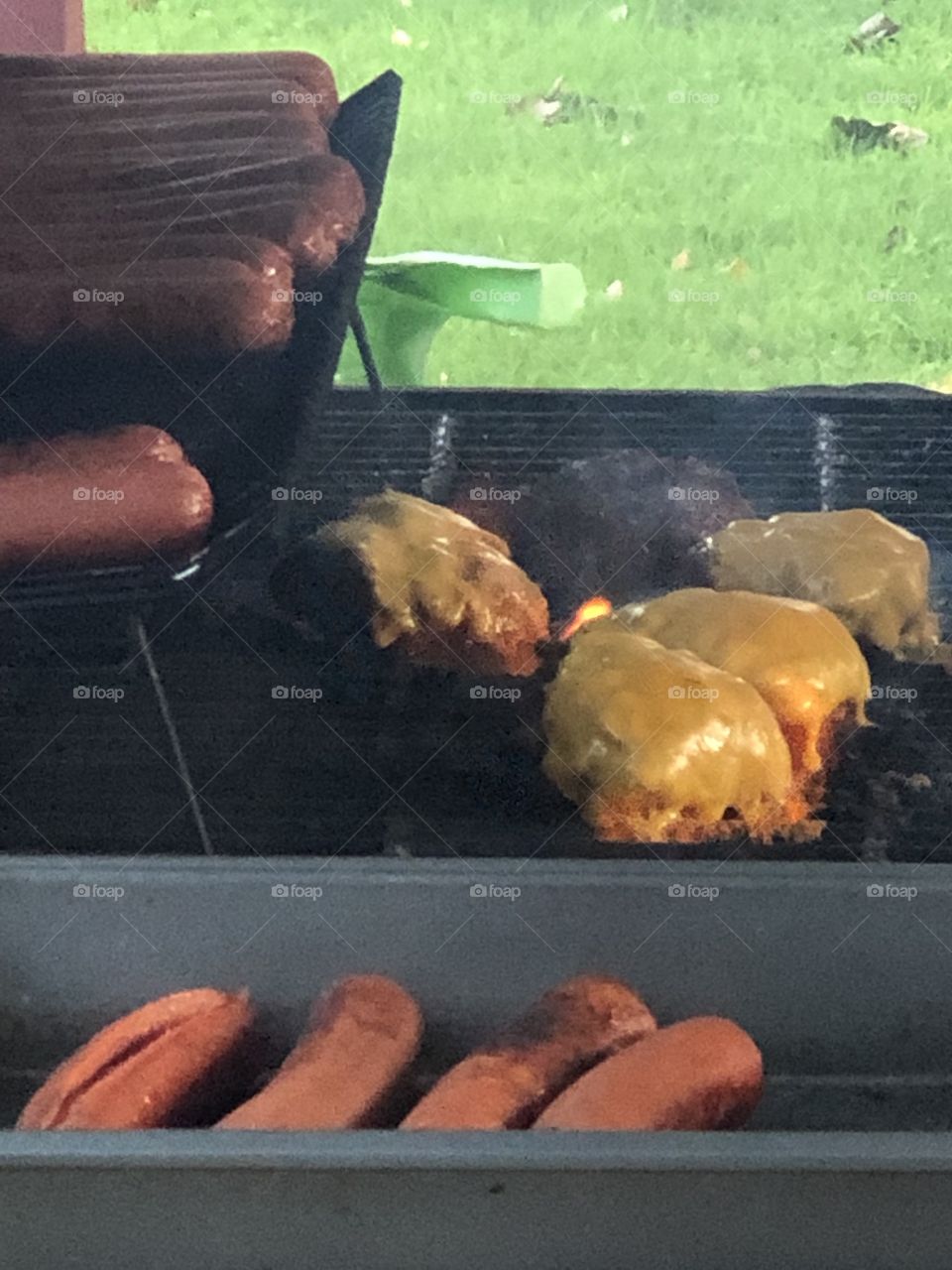 Grilling hotdogs and cheeseburgers