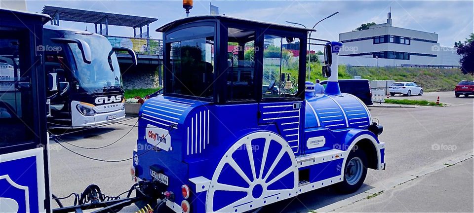 This blue locomotive pulls a passenger train up the mountain to “Liberation Hall” by “Kelheim”, Bavaria that was built in 1815 by King “Ludwig I” to celebrate Germany’s victory over “Napoleon” in the “Liberation Wars”. 2024. Hypnotic Productions