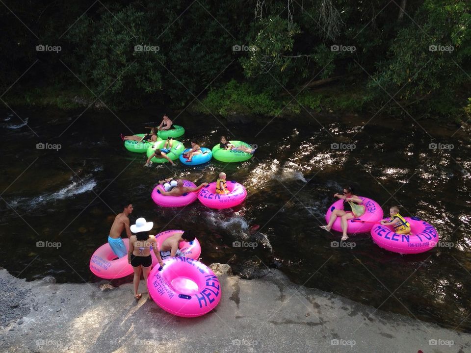 People with tubes in lazy river