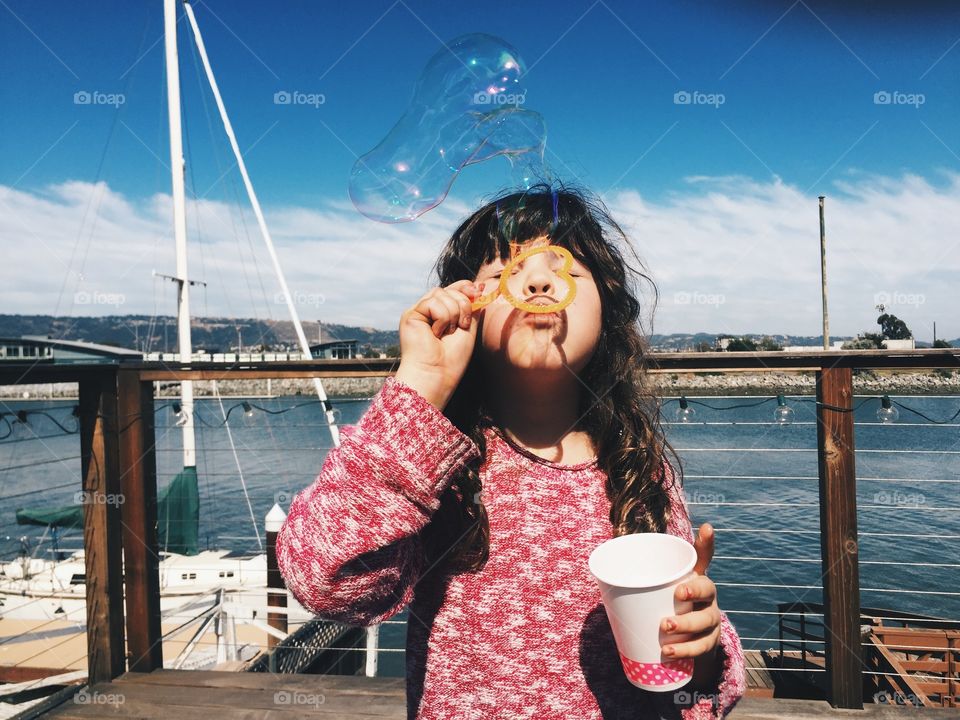 Girl blowing bubbles