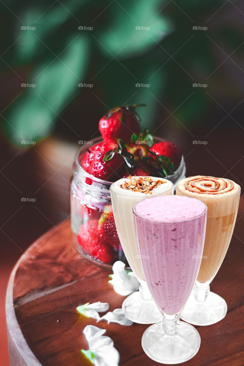 cold drink and yogurt icecream with strawberry fruit background