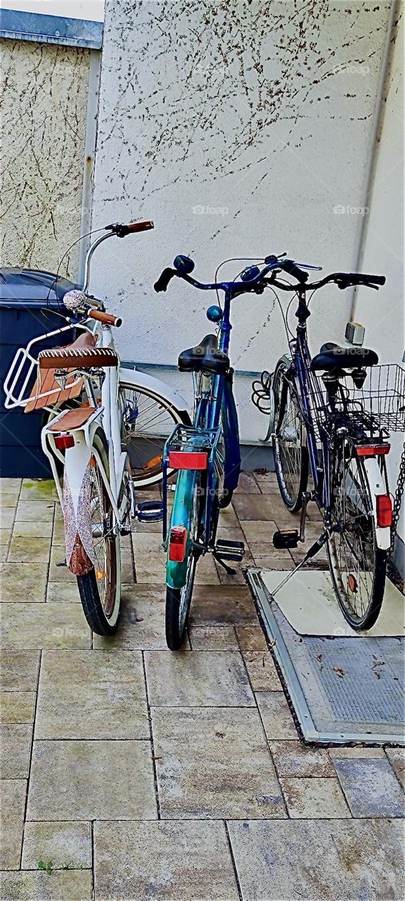 The new bicycle has been parked next to its older counterparts in a yard in rural “Bavaria”, Germany. Fun springtime riding time awaits !!! 2024. Hypnotic Productions