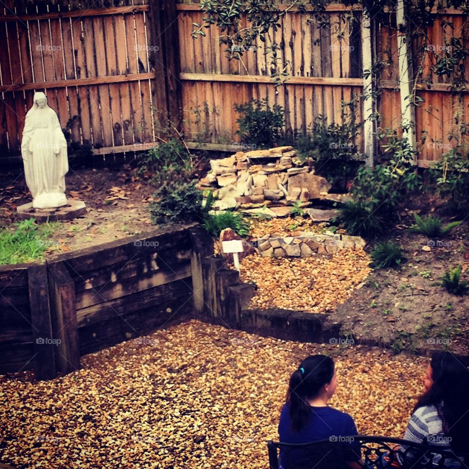 Quiet conversation . Women talking in a prayer garden