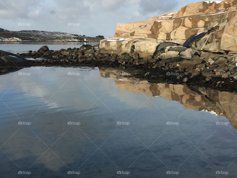 Rocks reflecting in lake