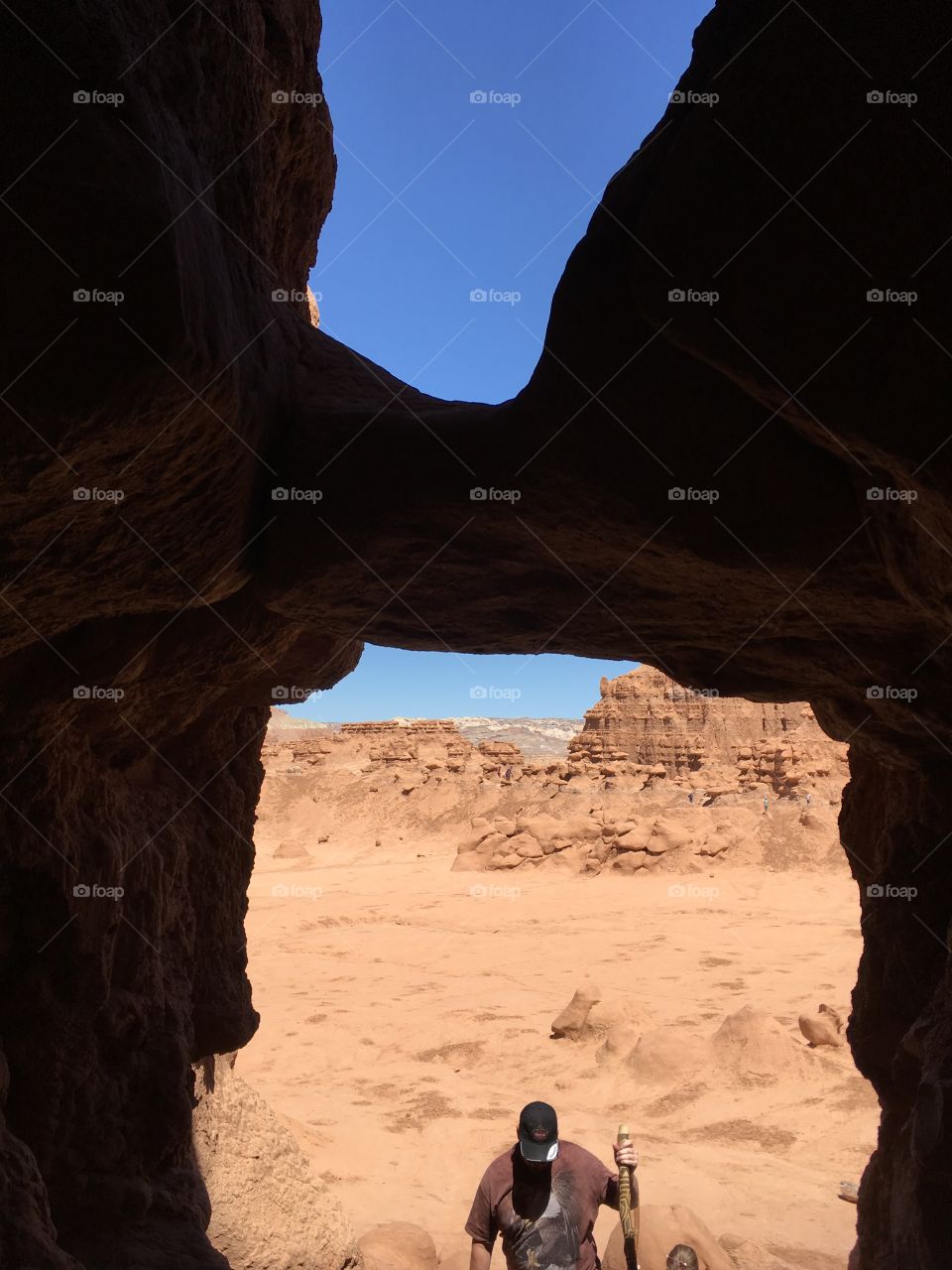Looking out a cave window in Goblin Valley, Utah.