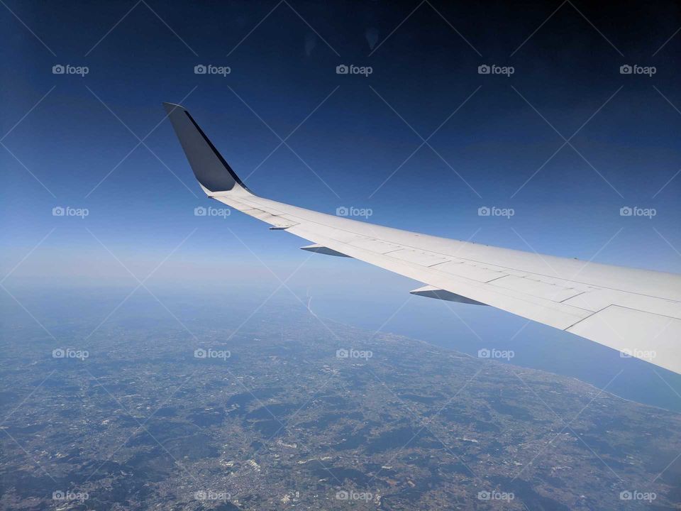 Airplane Wing and View Over Portugal - Passenger in Flight