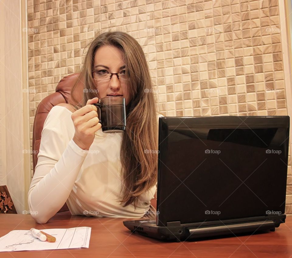 Business woman is holding a cup. Business woman is holding a cup