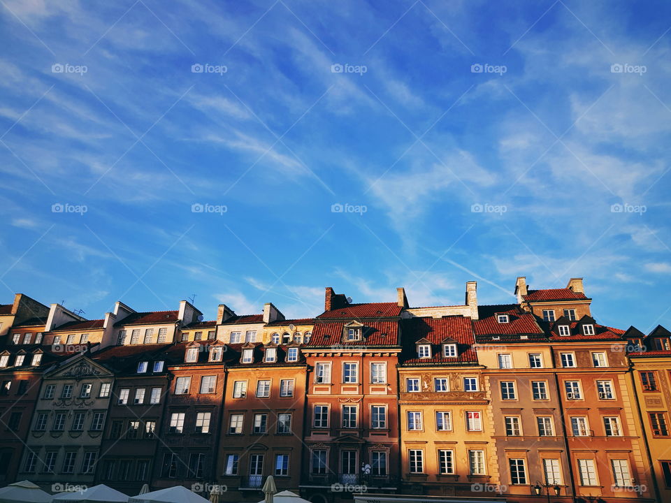 Stary miasto, old market rooftops in Warsaw lot with afternoon sunlight.