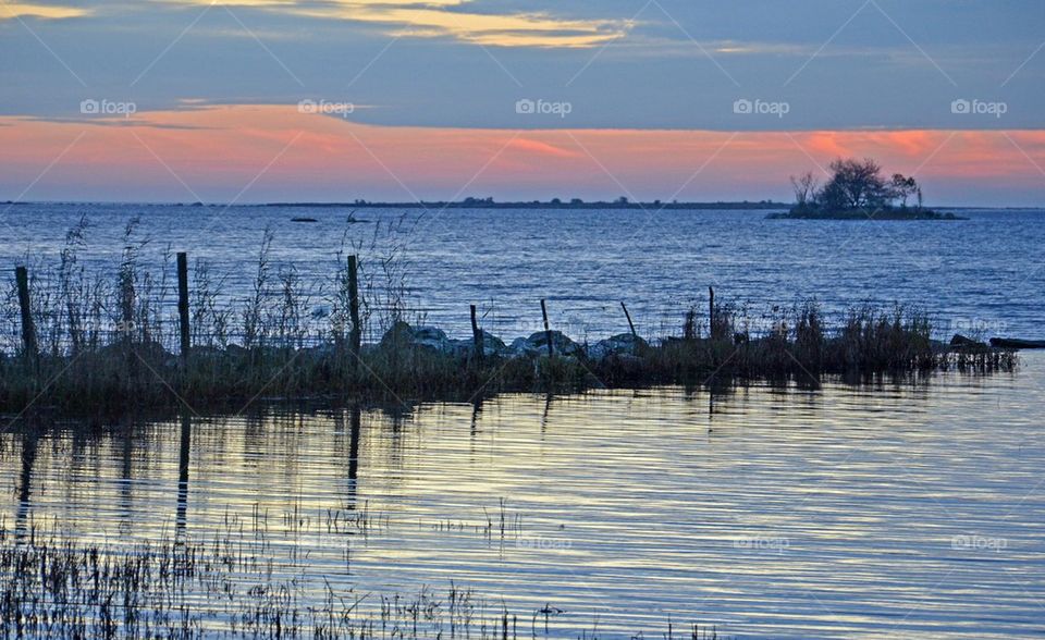 View of of calm sea at sunset