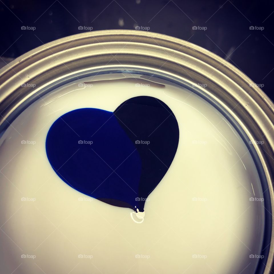 Blue and black heart in paint