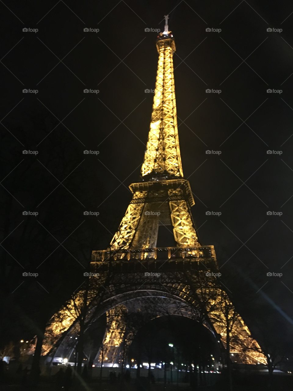 The Eiffel Tower in Paris, France at Night when it is lit up 