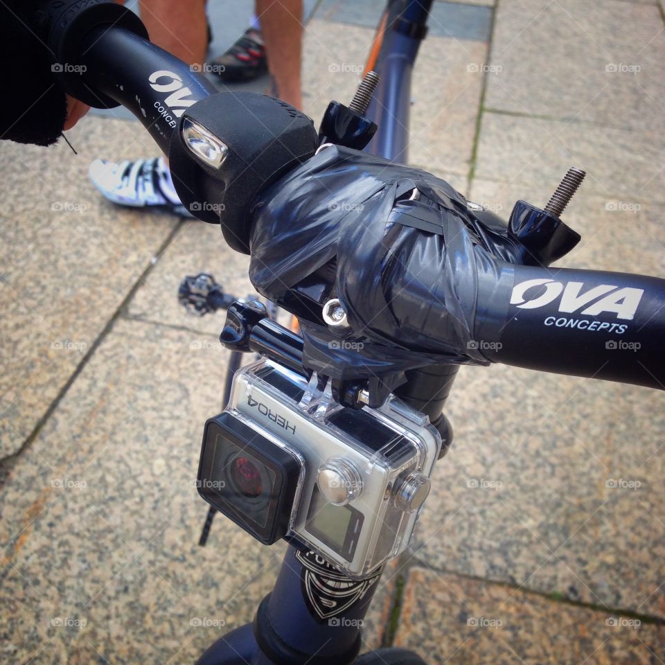 GoPro camera attached to the bicycle handlebar with a glue tape. Moscow, Russia