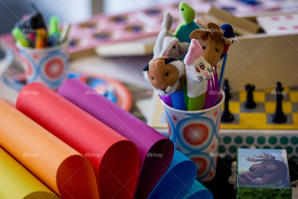 Finger puppets and brightly colored paper