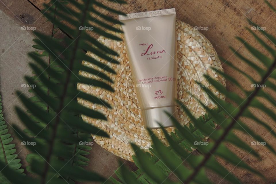 Showing the elegance of Luna hand lotion among the ferns.