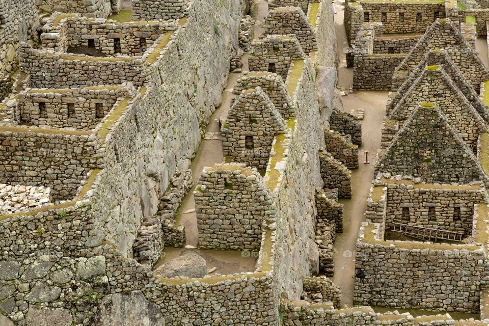 Machu Picchu ruins. Close up photo of famous Machu Picchu ruins. Stony structures. No people. Rock walls