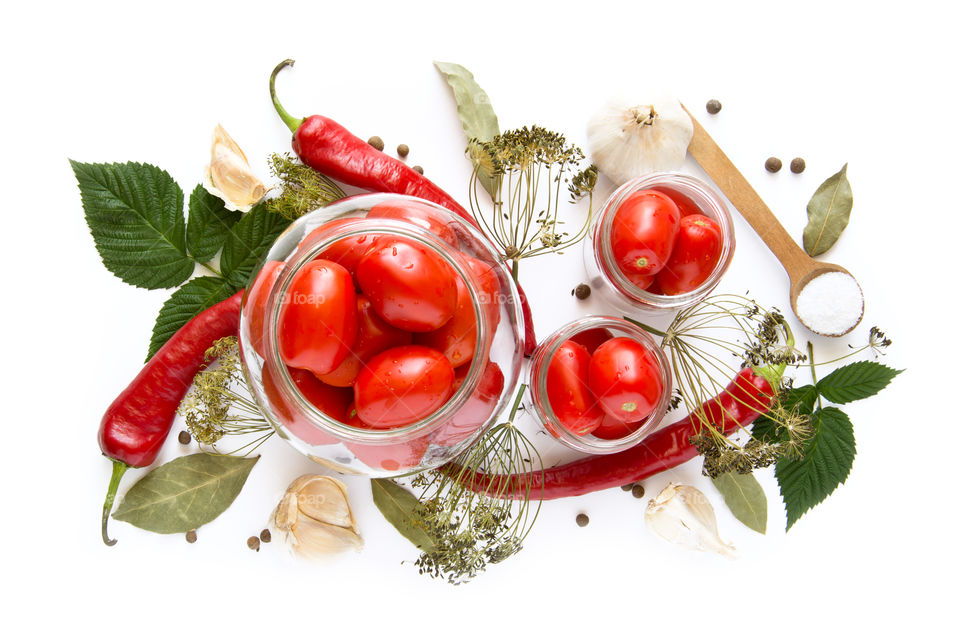 High angle view of ingredients and tomato on white backgrounds
