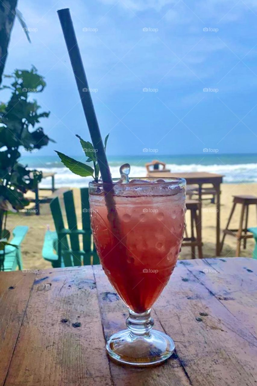 a refreshing cocktail in the beach