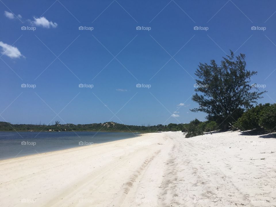 White sand beach in Mozambique with clear blue sky