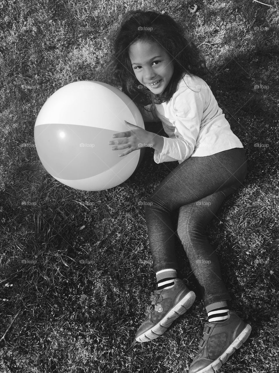 Elevated view of a smiling girl holding balloon