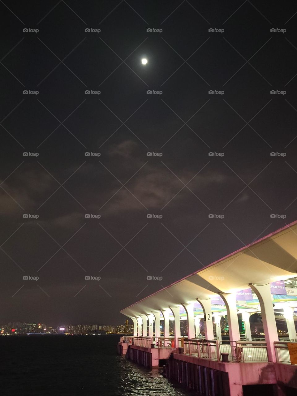 Moon over Wanchai Pier Victoria Harbour Hong Kong