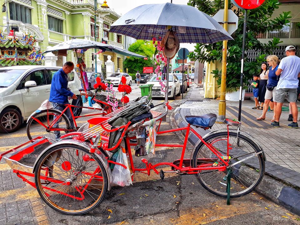 Traditional transportation called becak, that we can find in asia.
Location: Penang, Malaysia.
Photo taken using phone.