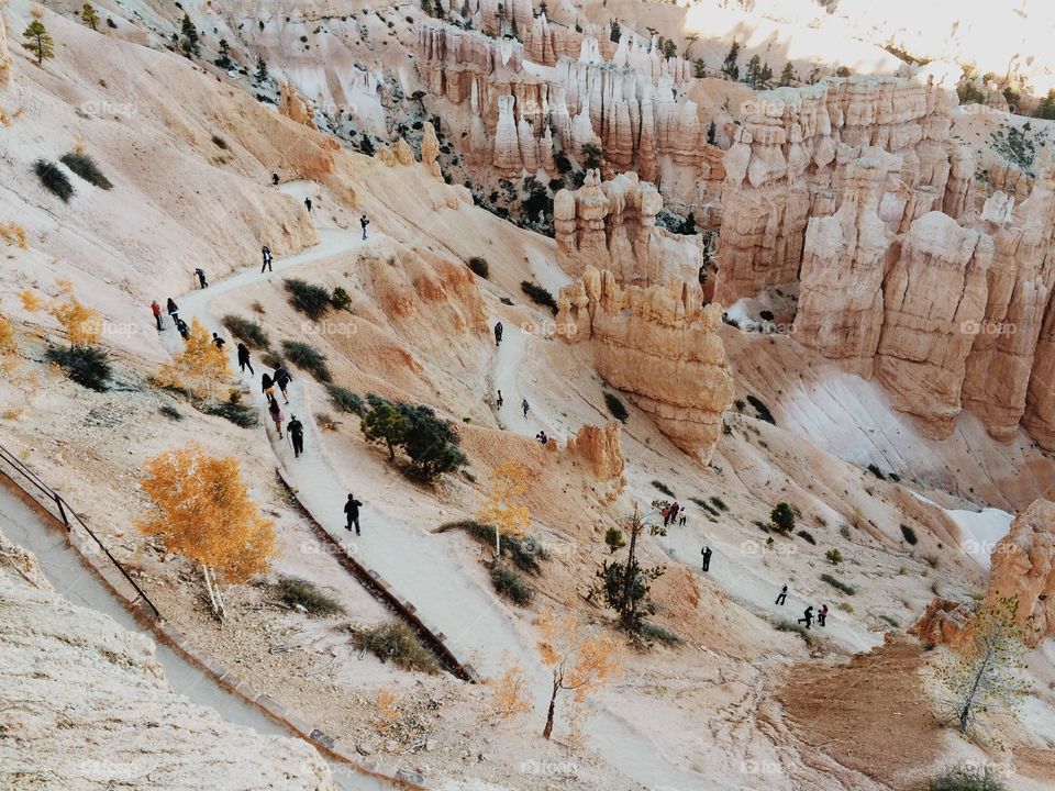 People hiking in sandstone