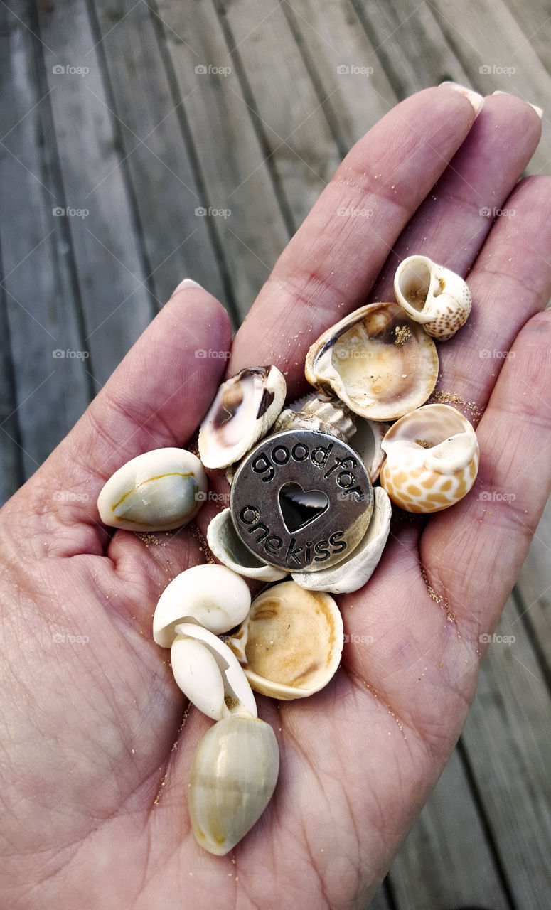handful of shells. shells and a kiss token